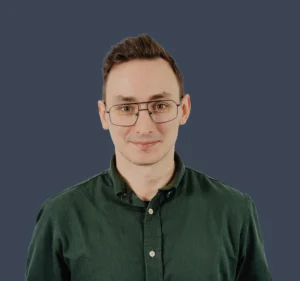 Portrait of Adrian Toczydłowski in a professional pose