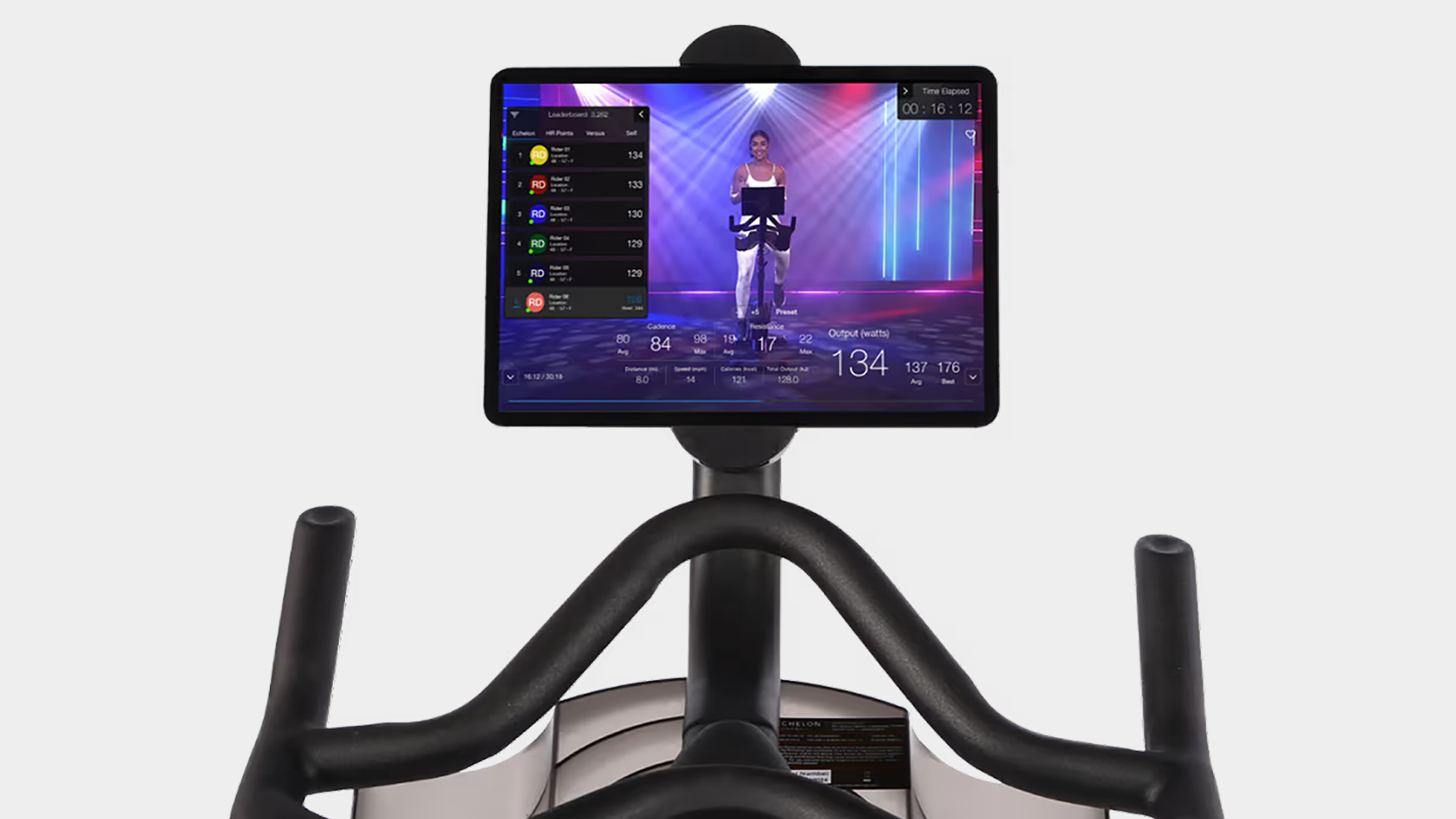 Exercise bike screen showing a live fitness class with instructor and performance stats.